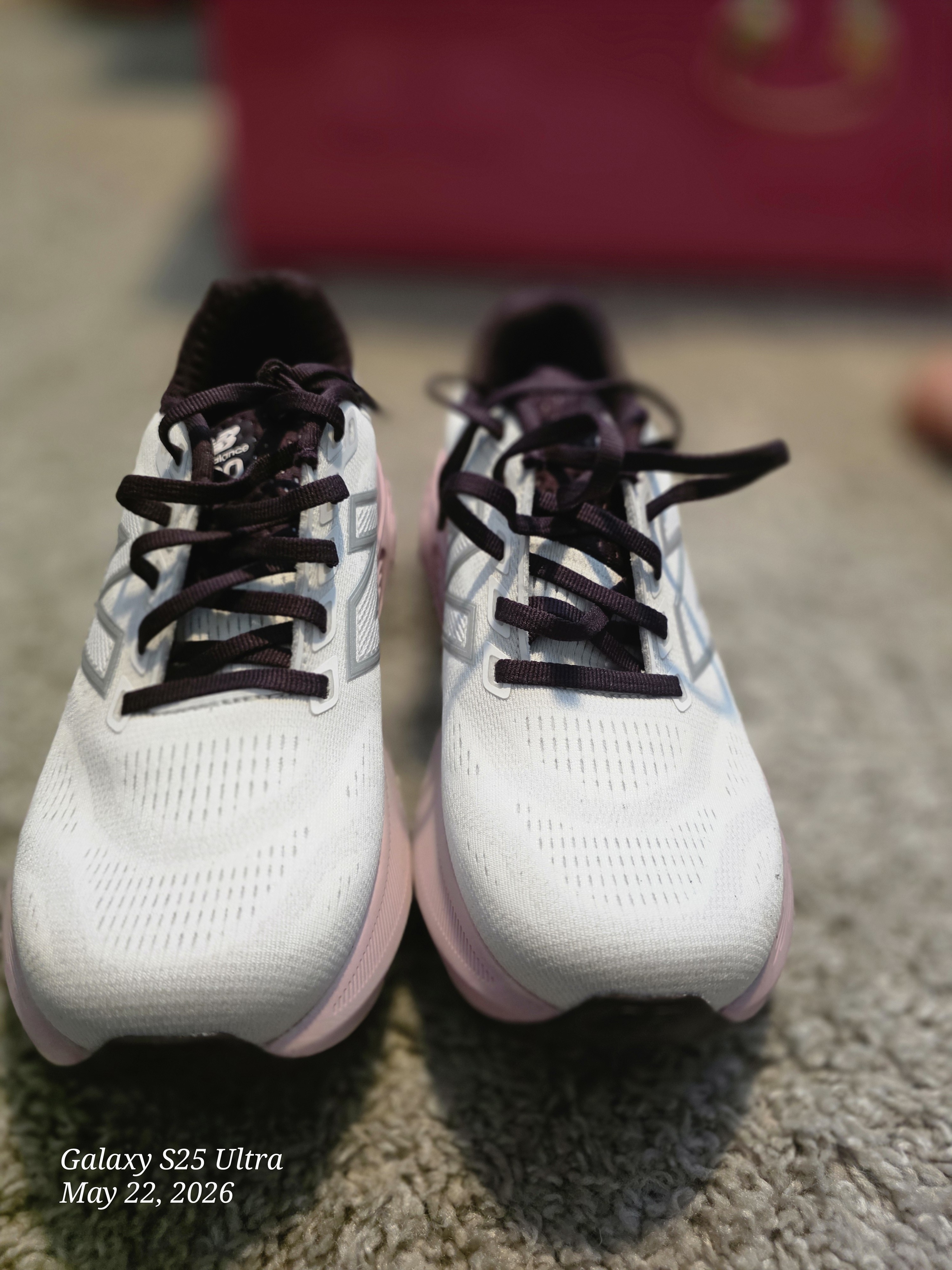 New Balance White Athletic Shoes With Pink Midsole And Dark Accents